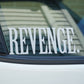 Car window with 'REVENGE' decal on a blurred background